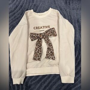 Girls cute sweater with bow on it